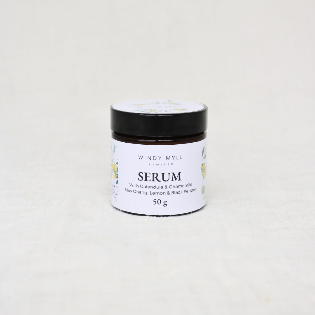 Jar of serum with a black lid