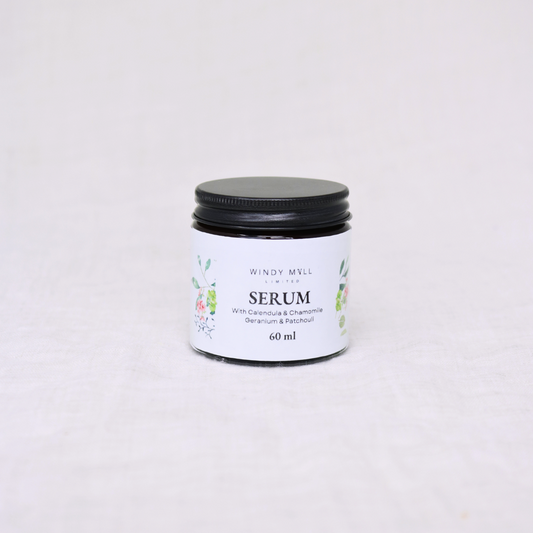 Jar of serum with a black lid
