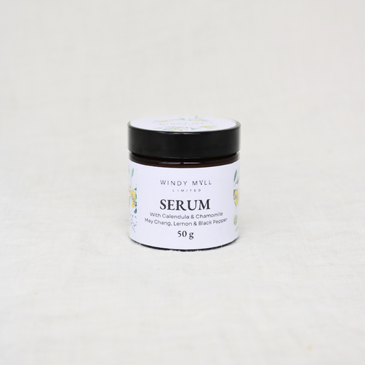 Jar of serum with a black lid
